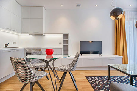 glass table in an apartment showing how to attach a glass table top