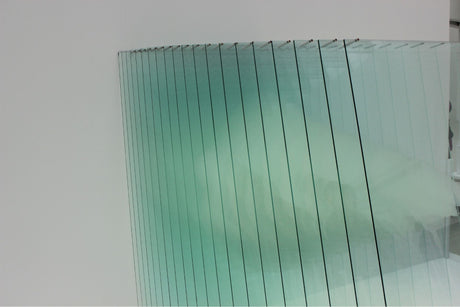 An image of glass panes leaning against a wall showing what is toughened glass