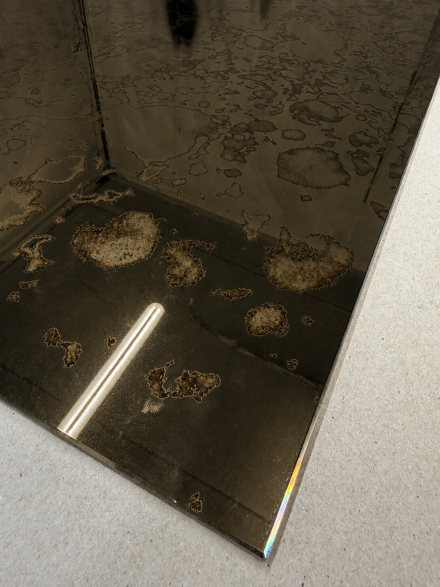 Antique brass mirror splashback close up