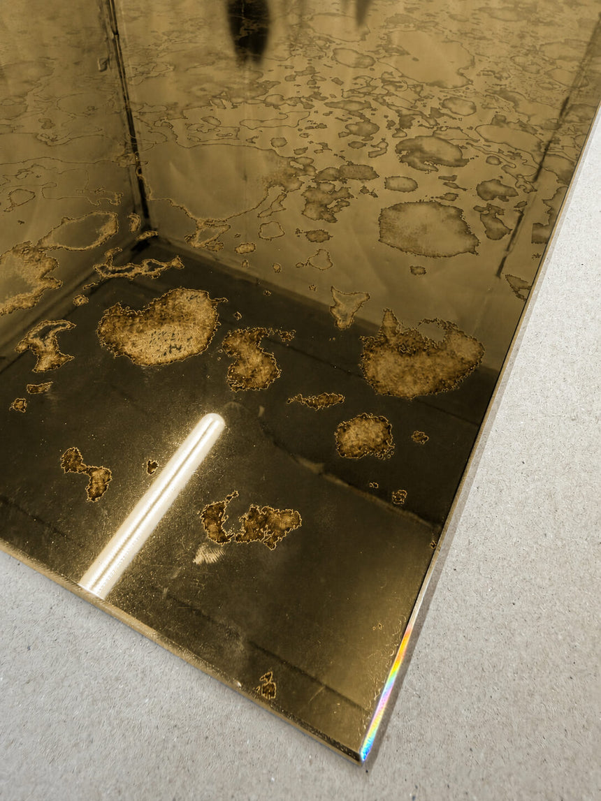 Antique gold mirror splashback close up