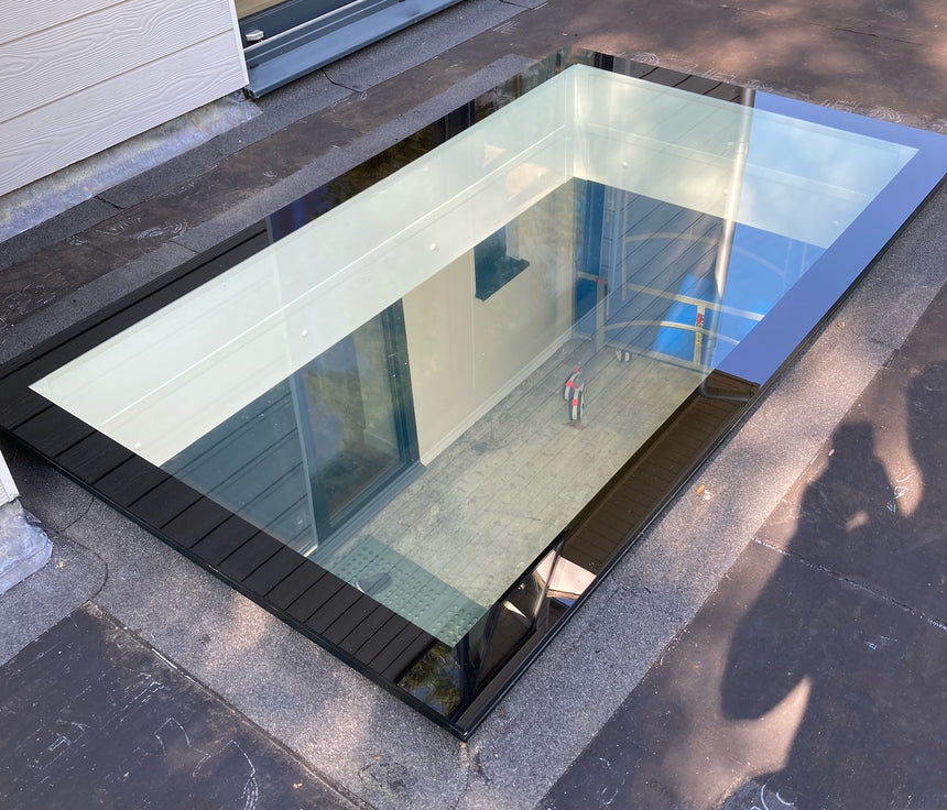 Switchable walk on glass skylight in a building, showing the interior below.