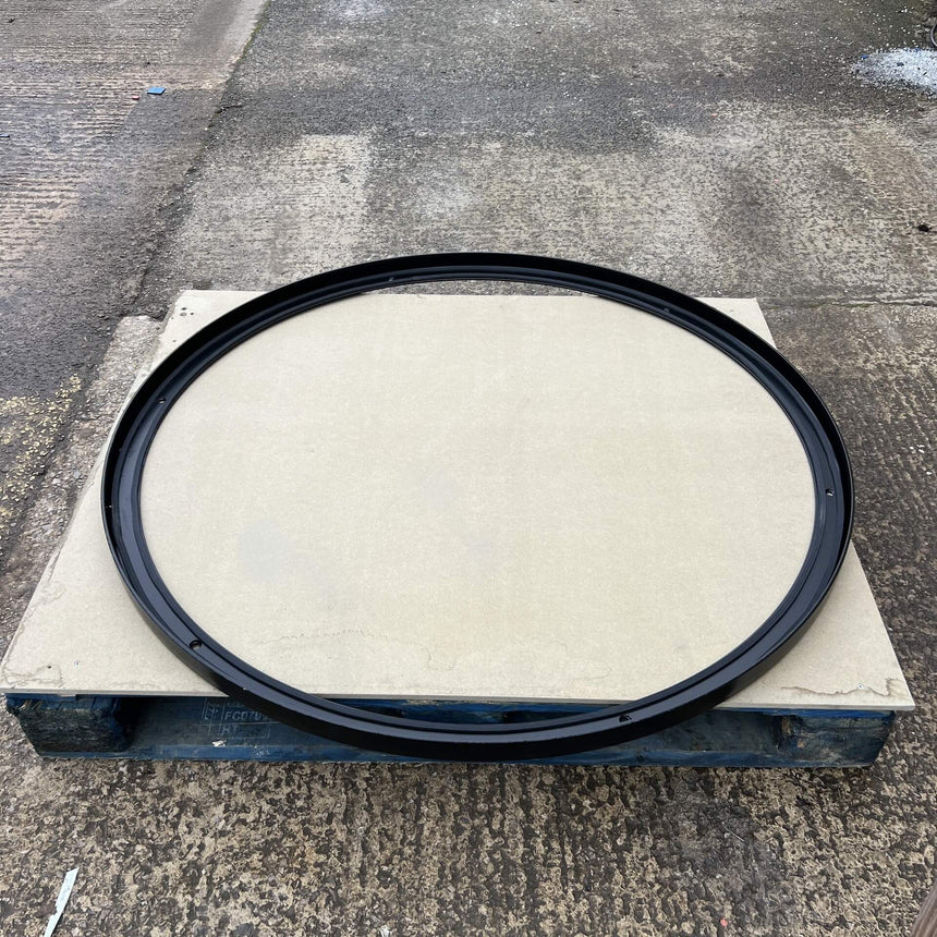 a glass well cover frame ontop of a pallet