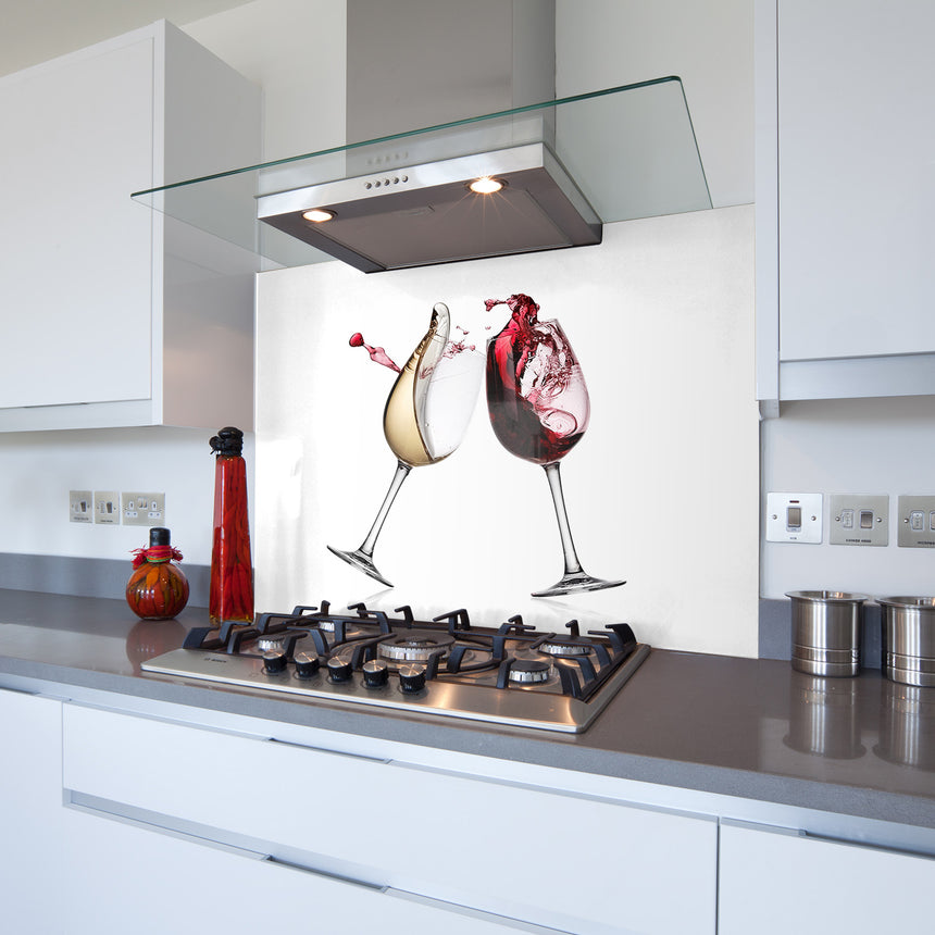 A kitchen splashback featuring a printed glass panel with two wine glasses design, installed on a kitchen wall above the stove.